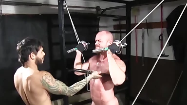 Gym basement torment and bondage for muscular hunk's submission